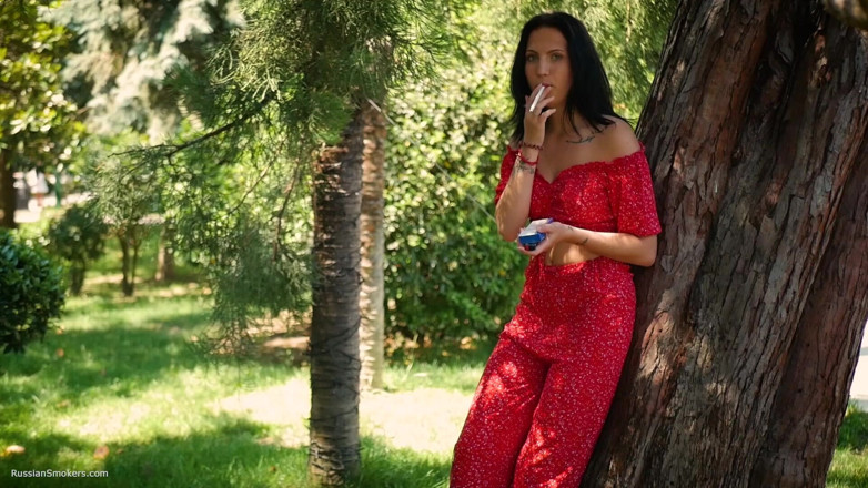 Russian Smokers: Seductive Russian Beauty Smoking Slim Cigarette Outdoors