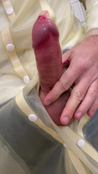 Putting a Condom on in Transparent Latex Raincoat