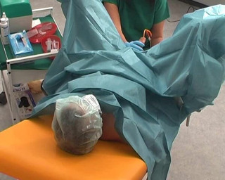 Rubber & Clinic Studio - 1ATOYS: Nurse in green surgery outfit