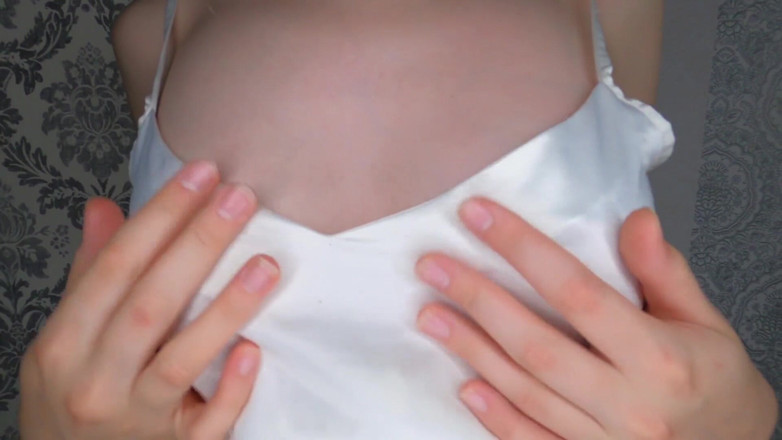 Kinodiva: Titted brunette rubs nipples with oil and plays with them