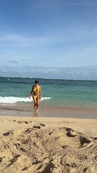 Teasing on the Beach in Micro Bikini on the Sand