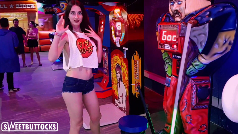 SweetButtocks: Hot teen in a short skirt is playing machine guns...