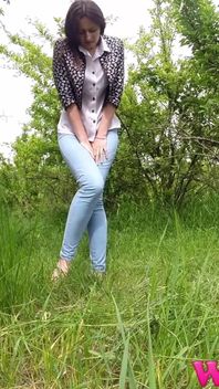 Desperate Skinny Girl in Jeans Trying to Hold Her Pee in the Forest