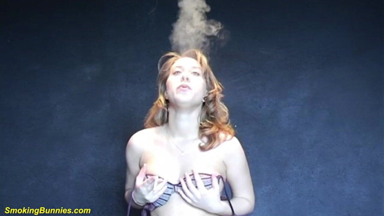 Smoking Bunnies: Busty redhead smoking and stripping