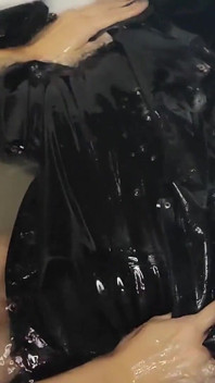 Taking a Bath in a Back Latex Catsuit