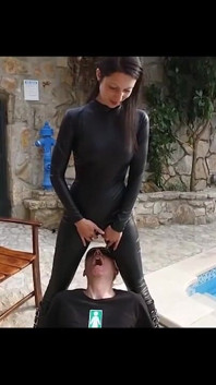 Blackhaired Domina in Latex Pissed Man in Mouth, Then He Licks Her After He Is Fucked Hard with a Strapon and Eats His Own Cum