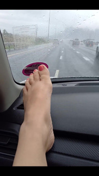 Feet on the Dashboard. a Little Peek at My Legs