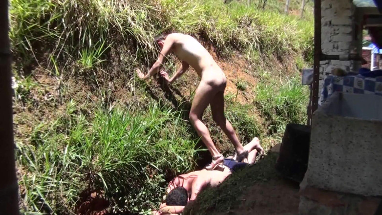 Femdom Austria: Nude babe stomping her slave in the backyard