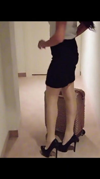 MILF in Stockings and Heels Walks Through the Corridors of a Hotel