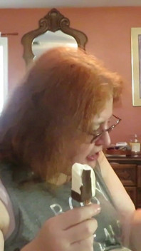 BBW nurse Vicki enjoys eatting a chocolate vanilla ice cream popsiscle
