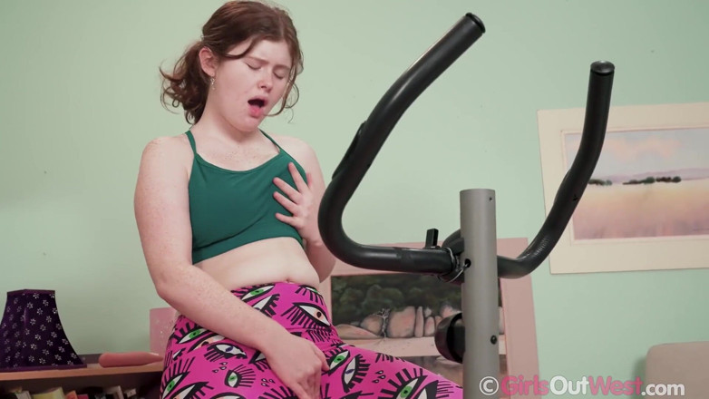 Girls Out West: Lovely hairy redhead rides spin bike and masturbates with big...