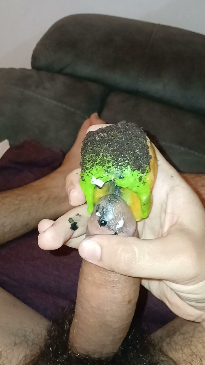 Alexander33324: Enjoying a Donut with Haloween Decoration.