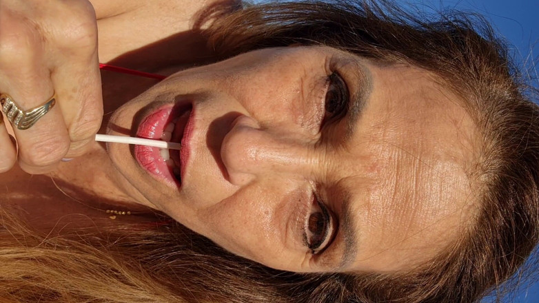 Melissa Johnson: Melissa Johnson Sucks and Licks a Cherry Lollipop on the.beach