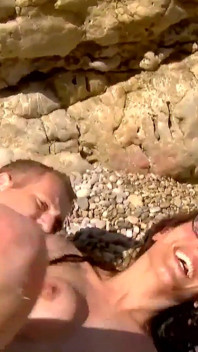 Raquel Abril a cheating whore with brown hair enjoys screaming with pleasure while fucking on a beach
