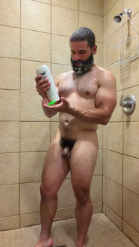 Muscle Cub with Dildo in Gym Showers