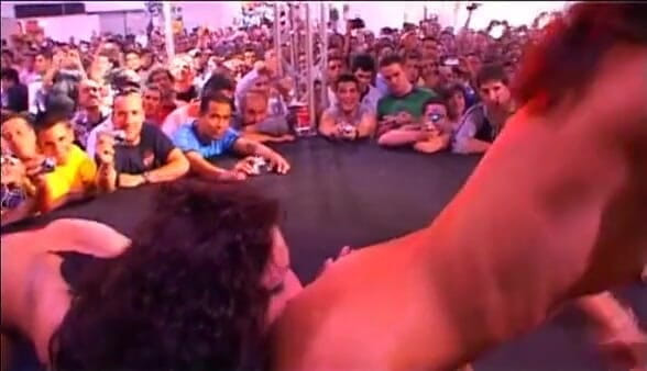 Java Consulting: Two girls pleasing a guy in front of an audience