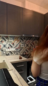 The Juggler Girl Is Here in a Long School Type Uniform Skirt to Flash Her Panties Under Her Miniskirt in the Kitchen