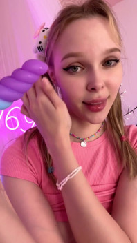 Toy in Mouth with an Innocent Stare