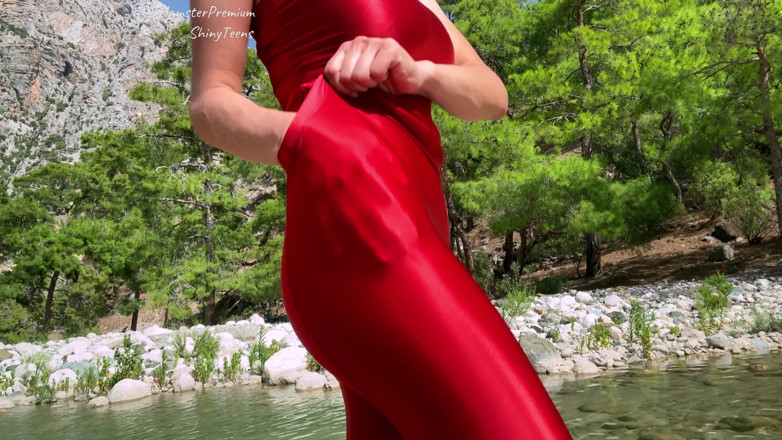 Shiny teens: Shiny red lycra tights and microdress on mountain river