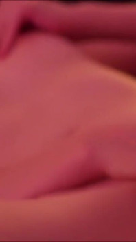 Short-haired blonde Emily masturbates on the bed