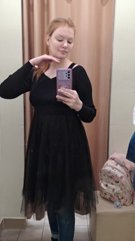 What Words Pop Into Your Head When You Look at the Red-haired Mistress in the Black Dress?
