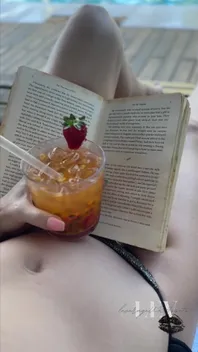 Reading by the Pool in a Bikini That Barely Counts as Spf