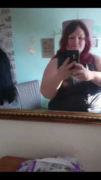 Showing off in a cool lab coat in front of the mirror