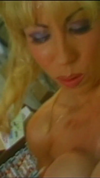 Busty Girl Made up in a Pornographic Warehouse