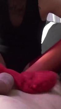 Melody Pleasure has nice red nylon stockings and gives Cheffie a footjob!