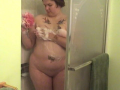 Solo Sensations: Tattooed fat chick strips to wash her tits and cunt...