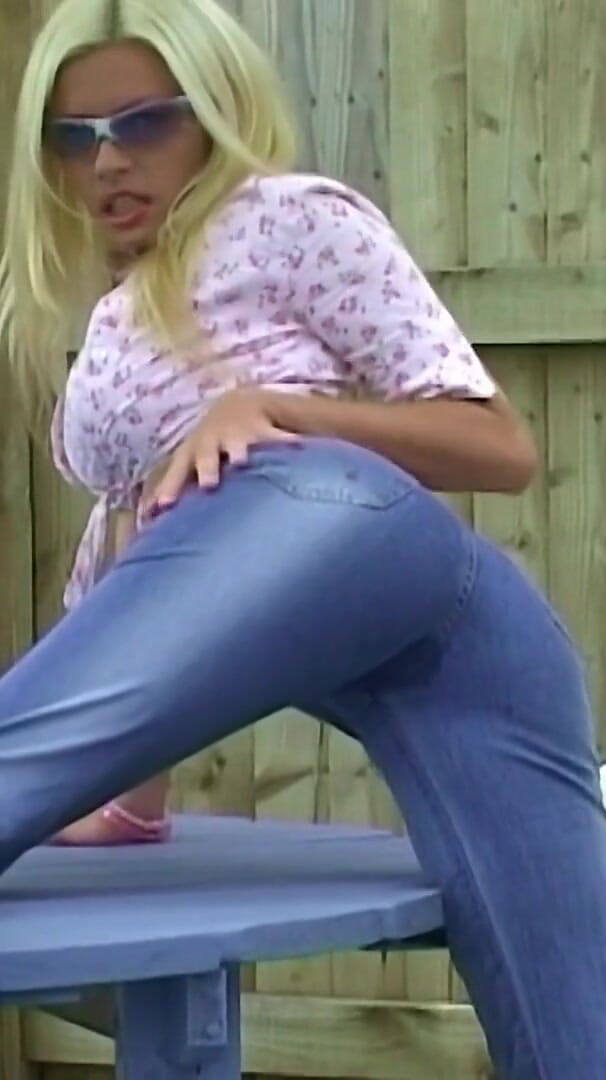 Pissing in her denim jeans