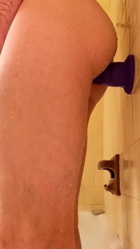 Dildo That Is Purple. Bathroom Anal Massage