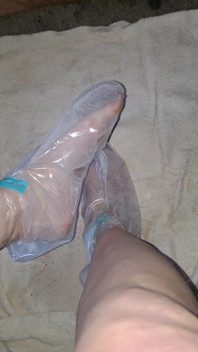 Pedicure Step Feet in Plastic Foot Mask Booties