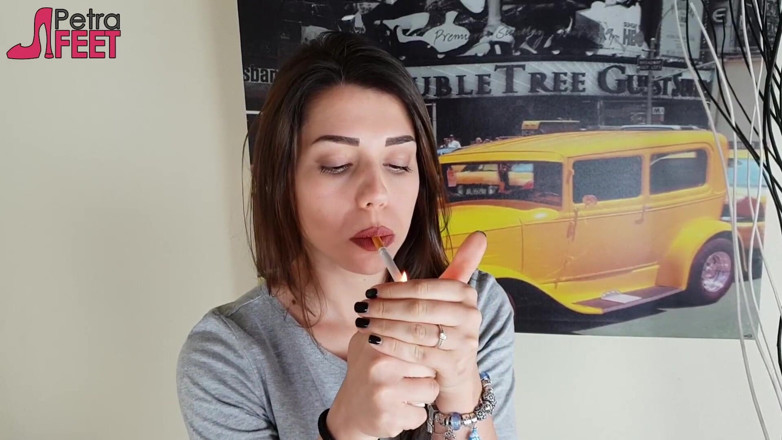 Smokin Fetish: Gorgeous brunette smokes a cigar in her bedroom