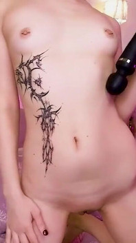 Naked Girl Plays with a Vibrator on Camera