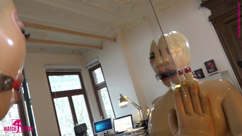 Fem Latex: Getting spanked latex doll