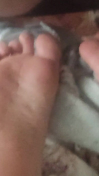 Playing with Friends Soles, While She's Reading.