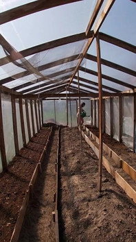 Nude house wife working in the greenhouse