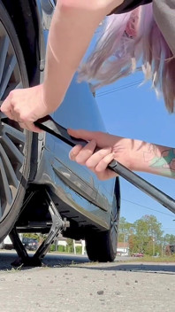 67 Tall Amazon Goddess Changes Her Tire - Big Feet in Frame