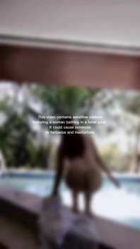 Woman Hijab Bathing Naked in an Open-air Hotel Pool