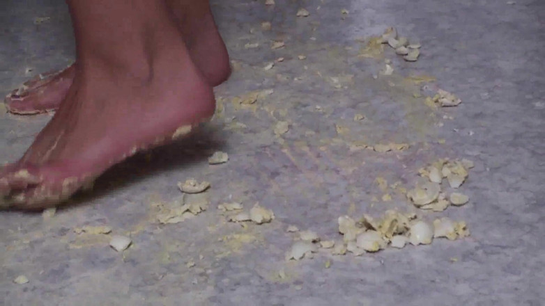 Foot Girls: Brunette crushing food in the kitchen