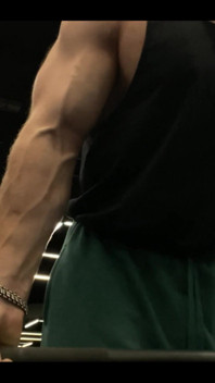 Doing a Biceps Curls with a Straight Barbell