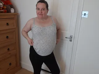 Wife Undressing in the Bedroom in Leggings