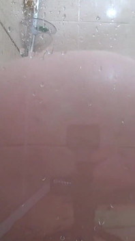 The camera is watching a mature chubby milf in the shower. Gorgeous fat ass, big natural boobs, hairy pussy. PAWG.