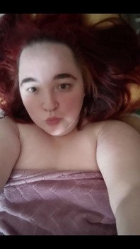Redhead in the Bed