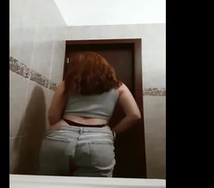Girl Undressing in Bathroom Before Shower