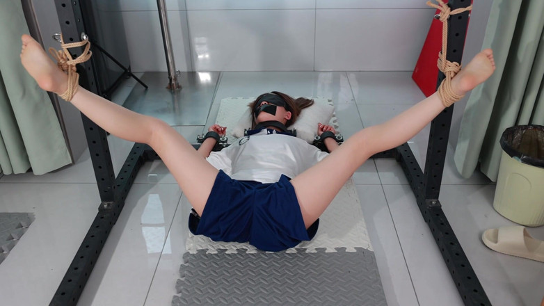 Cute girl bondage: The Girl in a Metal Fixed Position, Legs Spread and...