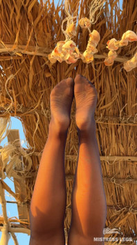 The Best View on the Beach Is Not the Sea, but My Feet in Black Tights Hanging Over Your Head