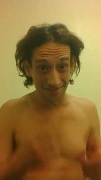 Topless Transgirl Trying to Hold a Pen W/her Tiny Boobs