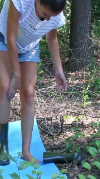 Sexy Babe Wearing Shorts and Rubber Boots Undress in the Forest and Play with Herself